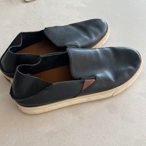 OluKai Black Slip on shoes.